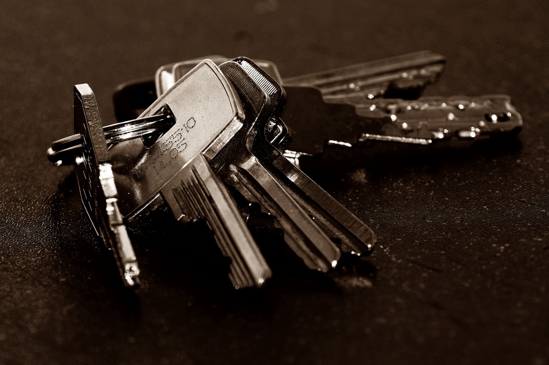 A bunch of keys on a dark surface