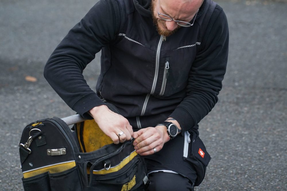 One of the team opening his tool bag
